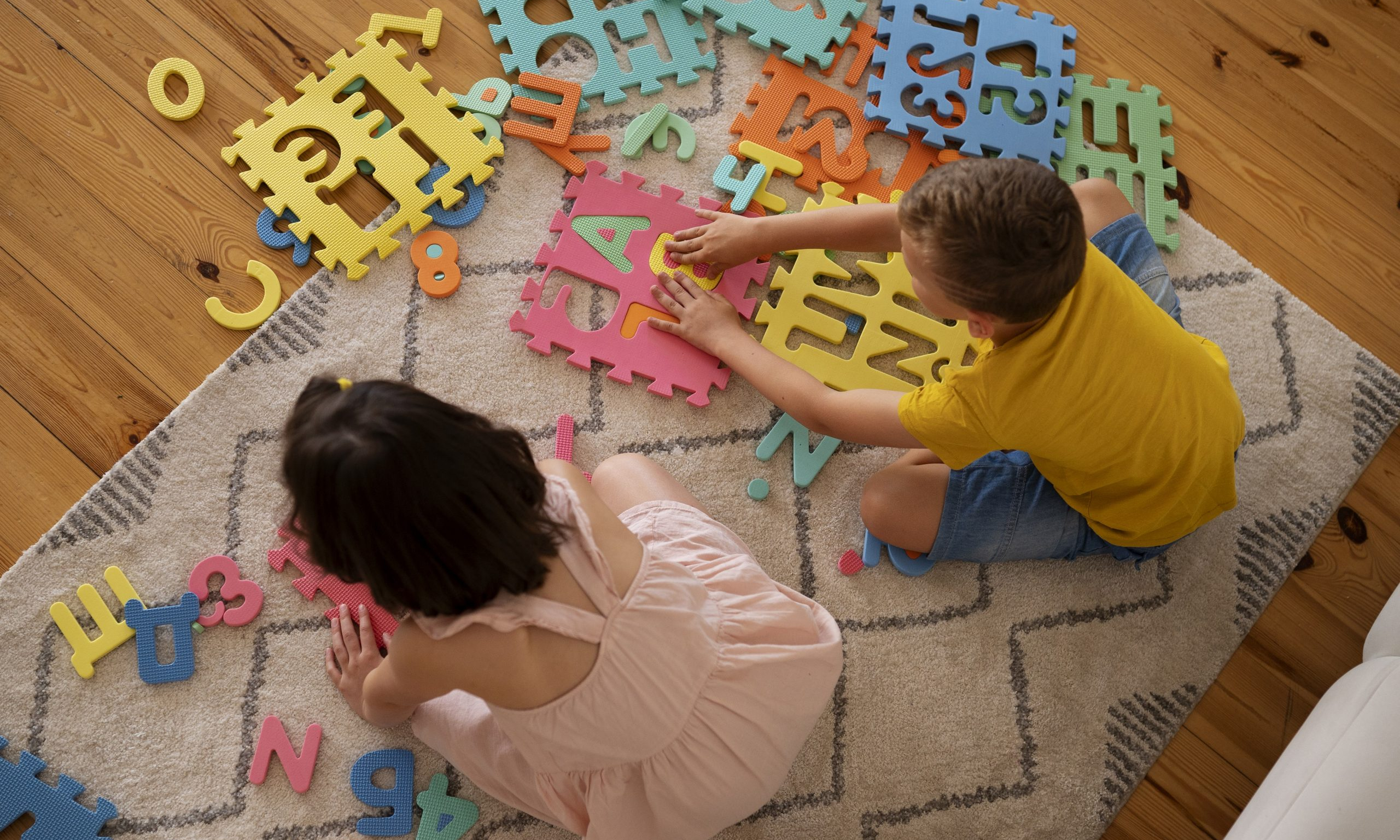 siblings-playing-with-brain-teaser-toys-scaled.jpg